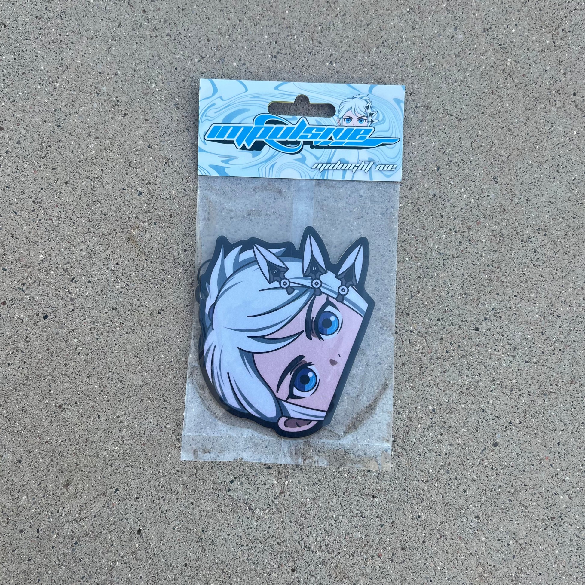 anime Character Jett, white blue shade anime character air freshener. 3 Knives in hair with blue eyes. Wing eyeliner. Character hanging from black string. Midnight ice Black Ice scent.