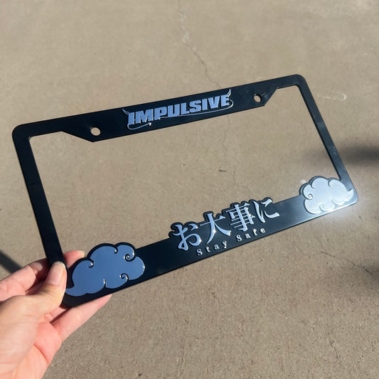 Multiple Japanese anime inspired plastic custom License Plate Frame. Top has Impulsive logo and the bottom has japanese characters and english translated to stay safe surrounding with japanese clouds. Asian inspired. Black Frame with Chrome lettering.