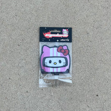 Load image into Gallery viewer, Sanrio Hello kitty racer air freshener hanging from black string. White cat with pink helmet white stripes, red bow anime japanese air freshener. Black Background with white sparkle stars. red y2k impulsive llc logo heart with cherry label cardboard head card.
