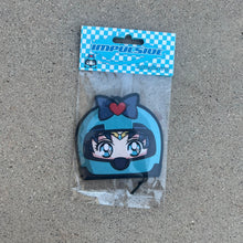 Load image into Gallery viewer, Sailor Moons friend sailor mercury air freshener hanging from black string. Wearing blue helmet with blue bow and red heart on blue eyed blue hair japanese anime girl. Blue and white checkered background with blue y2k impulsive logo and blueberry scent label cardboard head card packaging.
