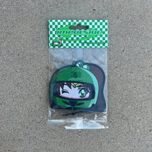 Load image into Gallery viewer, Anime Jupiter air freshener hanging from black string. Green helmet with brown hair pony tail anime japanese girl character with green eyes. Green checkered background with y2k impulsive logo and green apple scent logo cardboard head card packaging. 

