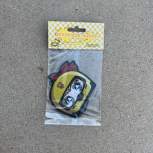 Load image into Gallery viewer,  Sailor Venus air freshener hanging from black string. Japanese anime character blonde hair blue eyes wearing yellow helmet with pendent logo and red bow. yellow and white checkered background with yellow y2k impulsive logo and lemon scent label cardboard head card packaging.
