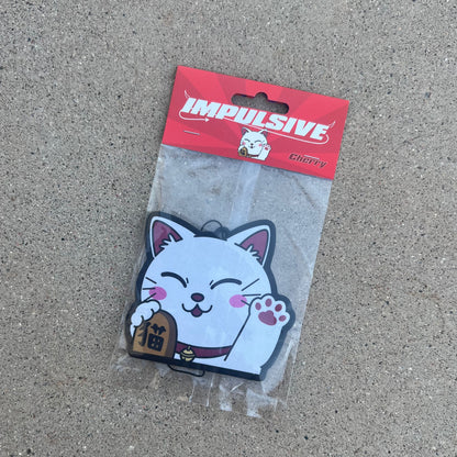 Original Character white Asian Chinese lucky cat holding gold with chinese character waving paw air freshener hanging from black string. Red asian inspired with white impulsive logo and cherry label cardboard head card.