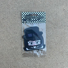 Load image into Gallery viewer, character tuxedo mask air freshener hanging from black string. male japanese anime character wearing black top hat with white glasses and black helmet.  black and white checkered background with black y2k impulsive llc logo and cologne scent label cardboard head card.
