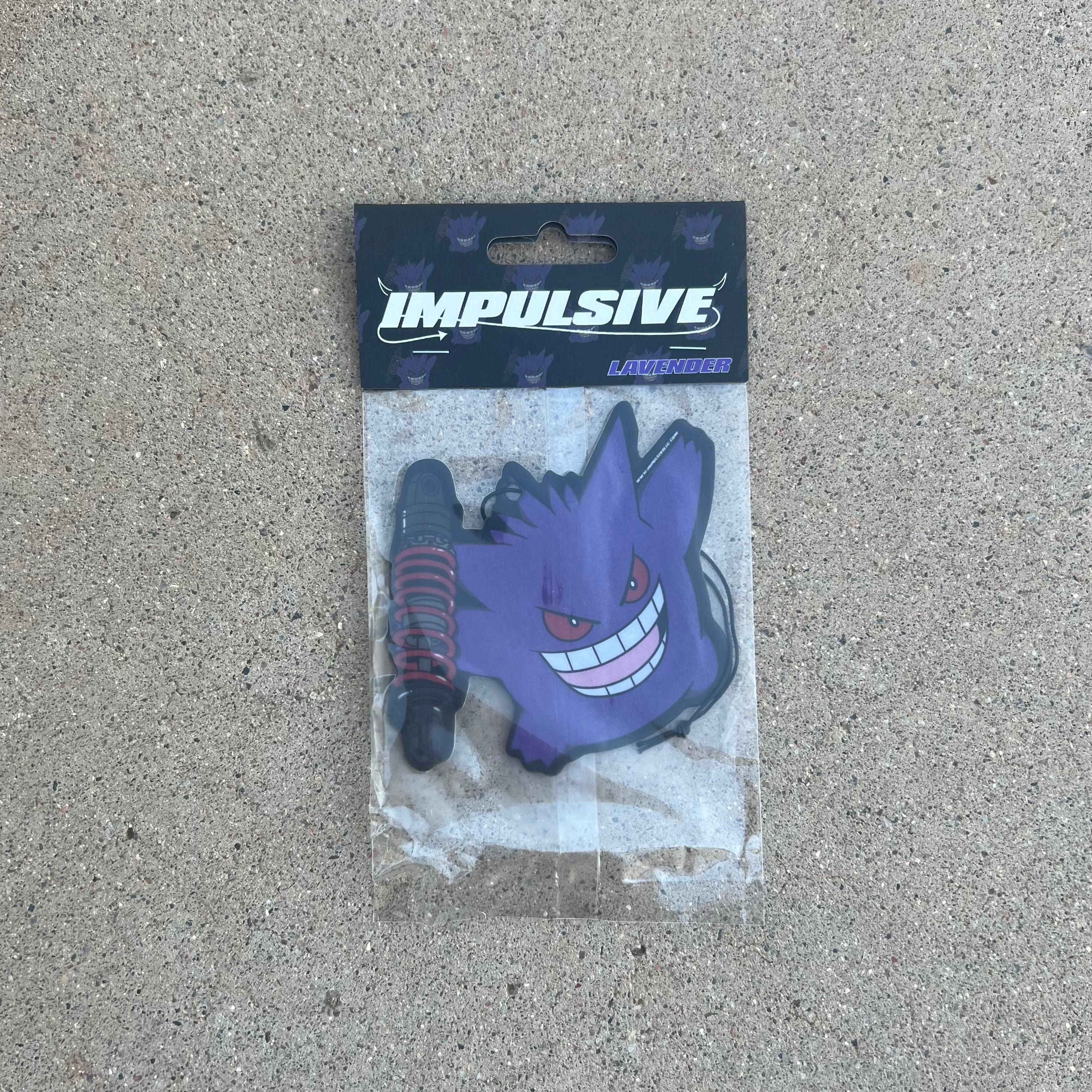 Pokemon Gengar Purple Monster holding Coilover car suspension hanging from black string air freshener. Impulsive LLC logo cardboard head card packaging. Lavender Scent air freshener