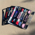 Japanese anime inspired plastic custom License Plate Frame. Top has Impulsive logo and the bottom has japanese characters and english translated to stay safe surrounding with japanese clouds. Asian inspired. Black Frame with Pink lettering.