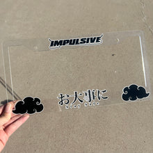 Load image into Gallery viewer, Japanese anime inspired plastic custom License Plate Frame. Top has Impulsive logo and the bottom has japanese characters and english translated to stay safe surrounding with japanese clouds. Asian inspired. Clear Acrylic cut Frame with black and white lettering.
