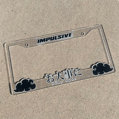 Japanese anime inspired plastic custom License Plate Frame. Top has Impulsive logo and the bottom has japanese characters and english translated to stay safe surrounding with japanese clouds. Asian inspired. Clear Acrylic Frame with Black and White lettering.