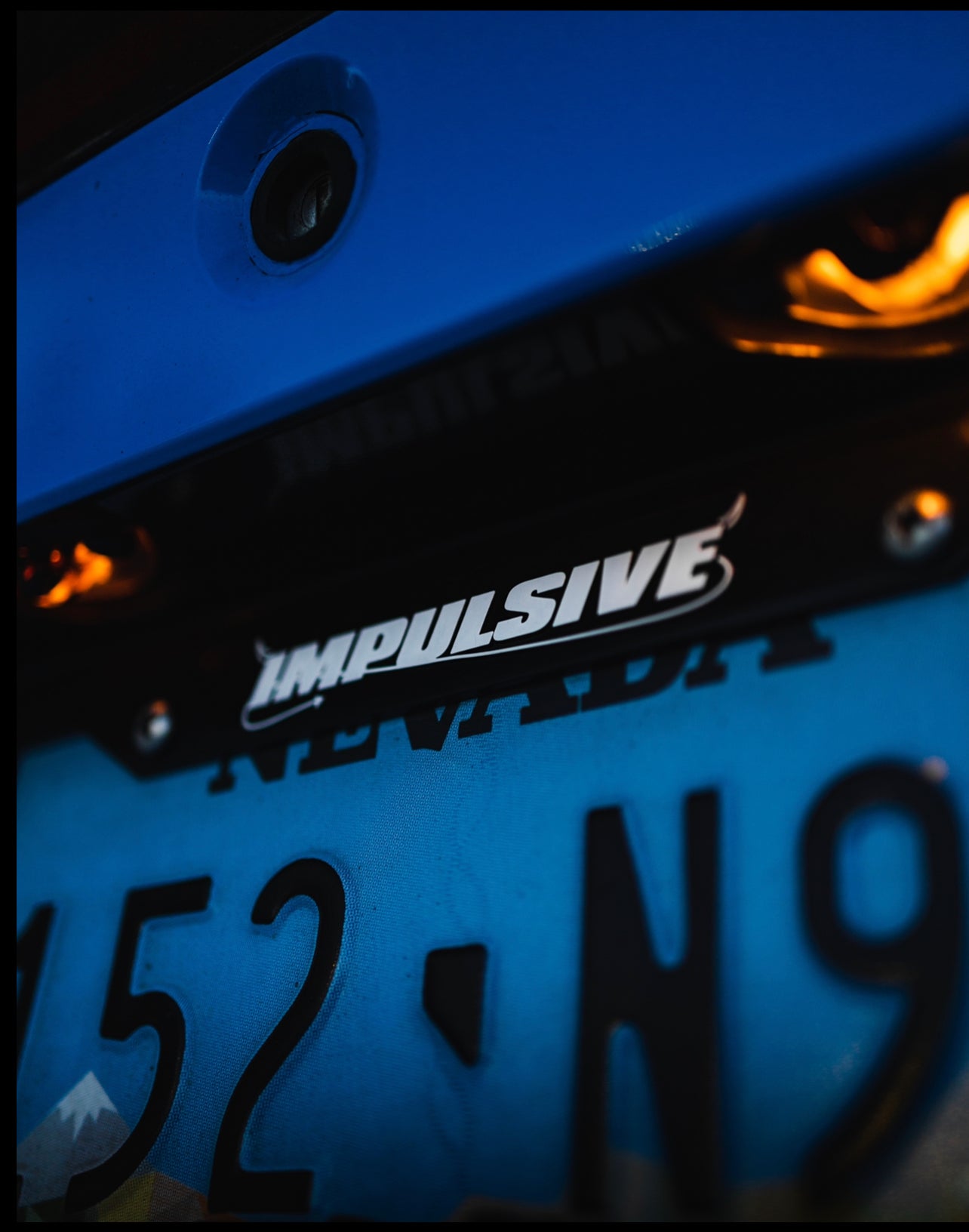 Multiple Japanese anime inspired plastic custom License Plate Frame. Top has Impulsive logo and the bottom has japanese characters and english translated to stay safe surrounding with japanese clouds. Black frame with white lettering