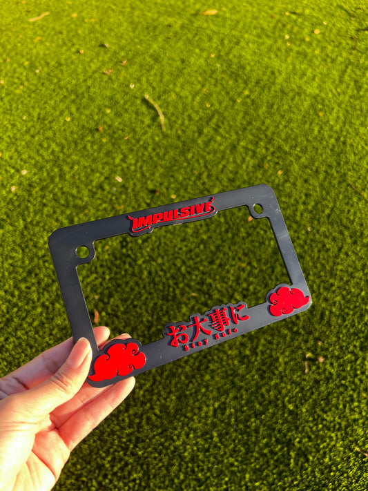 red motorcycle license plate frame with stay safe design