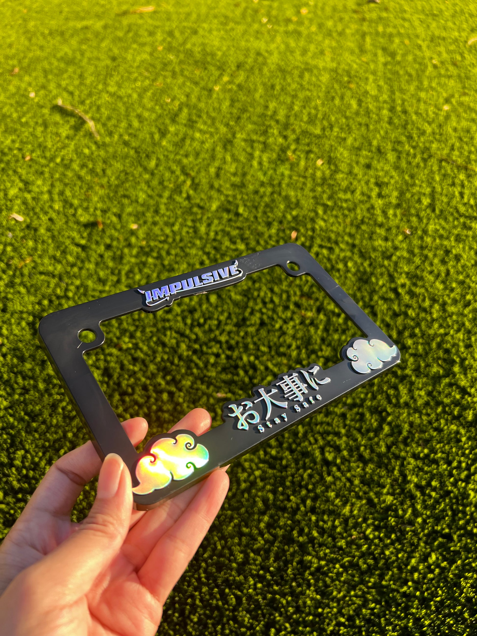 Oil slick motorcycle license plate frame with stay safe design