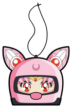 Load image into Gallery viewer, Chibi USA in pink helmet hanging from black string air freshener.
